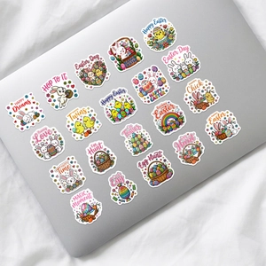 Close-up of cute Easter bunny and egg stickers on a laptop lid with vivid festive designs