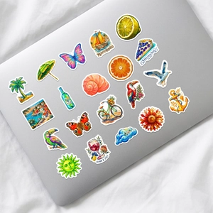 Detail of Mediterranean summer stickers on a laptop featuring birds and fruits