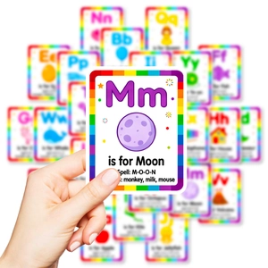 Child holding educational M for Moon alphabet flash card from a 26-piece card set