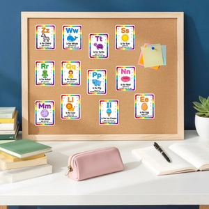 Detailed educational alphabet flashcards with vibrant illustrations on a cork board