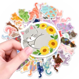 Close-up of a cute sleeping cat sticker in a sunflower wreath for journal decoration