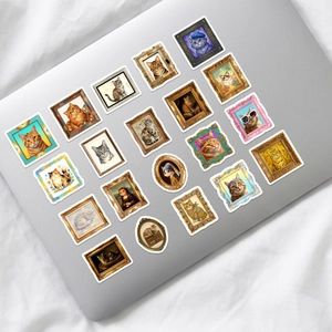 Artistic cat stickers featuring famous paintings on a laptop with a vintage aesthetic