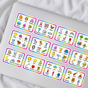 Detail of colorful English learning stickers with cartoon animals on a silver laptop
