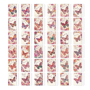 Close-up of 36 thank you cards with colorful butterfly and floral patterns on white cardstock