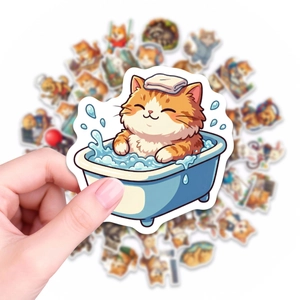 Close-up of a waterproof cartoon cat sticker being held to show size and quality