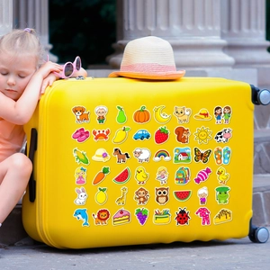 Detailed view of colorful waterproof cartoon stickers applied on a yellow suitcase