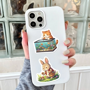 Detail of cartoon animal stickers on a phone case featuring a cat and rabbit