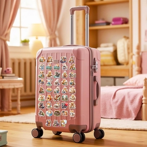 Waterproof animal stickers featuring cats and dogs applied on a pink travel suitcase