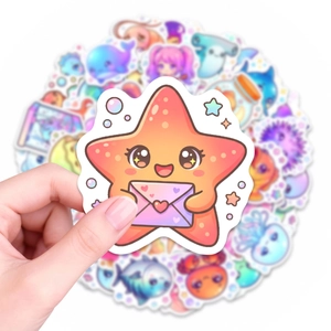 Close-up of cute cartoon starfish sticker with heart envelope and macro depth effect