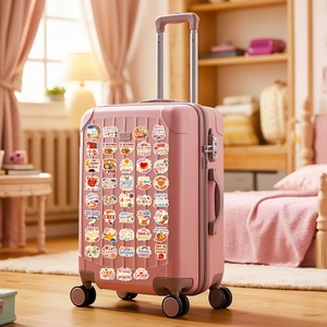 Waterproof Spanish motivational stickers shown on a pink suitcase with floral designs