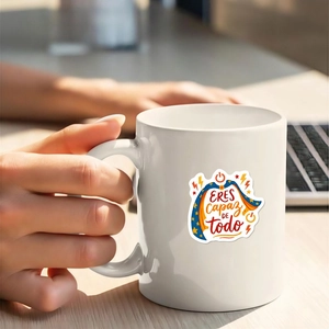 Close-up of white ceramic mug with Spanish motivational text Eres capaz de todo