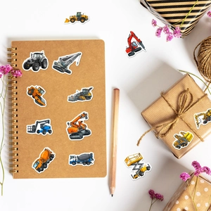 Detailed stickers showing construction vehicles on notebook and gift box with deco