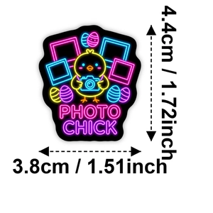 Neon cartoon chick sticker with camera and dimensions 4.4cm by 3.8cm on white background