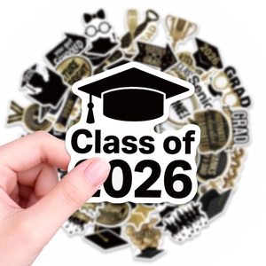 Detailed view of black and gold 2026 graduation stickers featuring Class of 2026 motifs