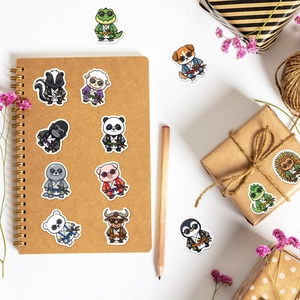Close-up of cute cartoon samurai animal stickers on a notebook and gift box with deco