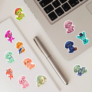 Close-up of waterproof cute dog stickers decorating a laptop and notebook set