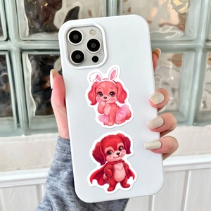 Close-up of white iPhone case with cute cartoon dogs and pink ballet outfit