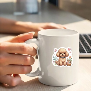 Close-up of white ceramic mug featuring cute cartoon dog stickers in a cozy scene