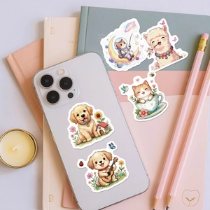 Detailed view of waterproof cartoon pet stickers on a phone case and notebook cover