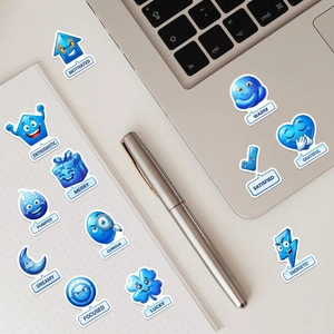 Détail d'autocollants d'émotion 3D bleus avec texte anglais sur ordinateur et carnet