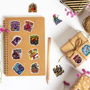 Detailed view of colorful monster graffiti stickers applied on a notebook and gift box
