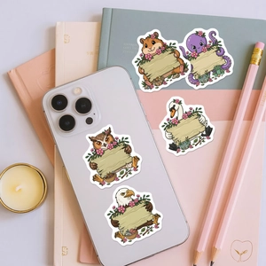 Flat lay of cute cartoon animal stickers holding blank wooden signs for DIY scrapbooking