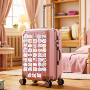 Y2K Vintage-Aufkleber auf rosa Koffer mit Retro-Elektronik und Pixel-Art-Grafikdesign