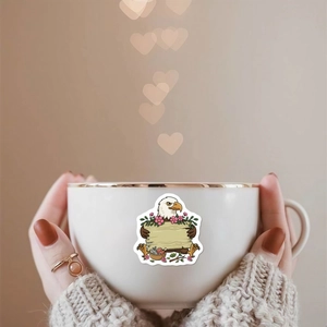 Cute cartoon eagle holding a blank wood sign sticker applied on a white ceramic mug