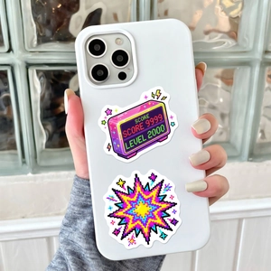 Close-up of retro pixel art game stickers on a minimalist white smartphone case
