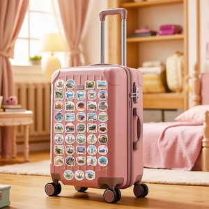 Waterproof world travel stickers applied on a pink suitcase for luggage decoration