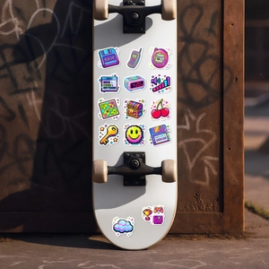 Detailed view of waterproof Y2K pixel art stickers applied to a white skateboard deck