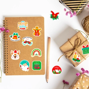 DIY Christmas stickers on kraft notebook and gift box for holiday crafts decor