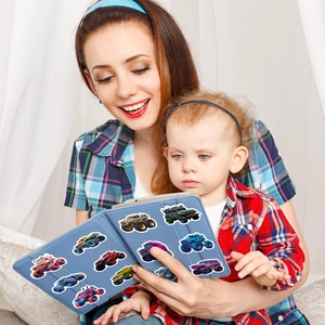 Cartoon monster truck stickers decorated on a blue tablet case in a family setting