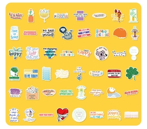 Flat lay of colorful waterproof inspirational stickers for skateboards and laptops
