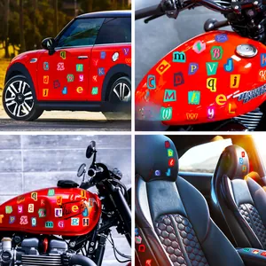 Colorful ransom-style alphabet stickers applied on car doors and motorcycle tanks
