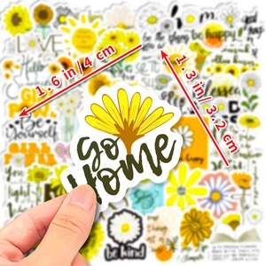 Close-up of 4cm sunflower and motivational text stickers for water bottles and laptops