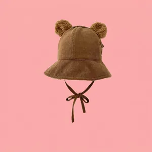 Brown corduroy winter bucket hat for kids with plush bear ears and chin straps