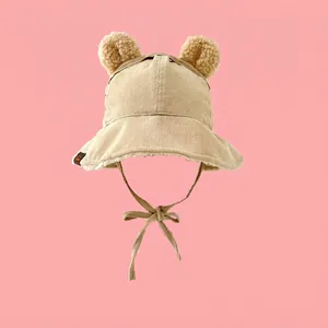 Detail of baby corduroy bucket hat with plush bear ears and warm sherpa fleece lining