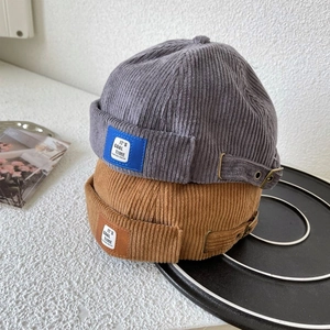 Retro corduroy docker hats in grey and brown with adjustable metal buckle for a stylish fit