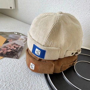 Retro corduroy docker hats in beige and brown with adjustable metal buckle strap