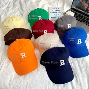 Variety of cotton baseball caps with R letter embroidery in nine different colors