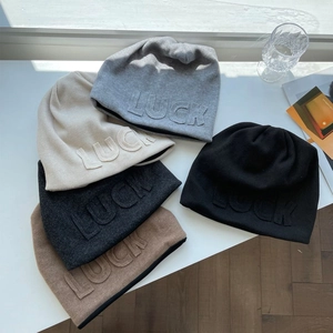 Women's knit slouchy beanie set with LUCK embossing in five trendy neutral colors
