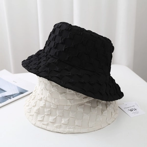 Black and cream pleated seersucker bucket hats with textured bubble fabric design