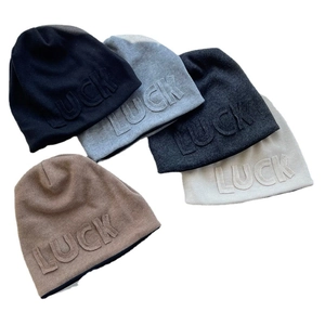 Slouchy knit beanie with 3D LUCK letters available in multiple neutral color tones