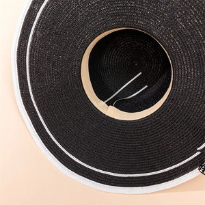 Close-up of woven straw hat interior with adjustable sweatband and color contrast