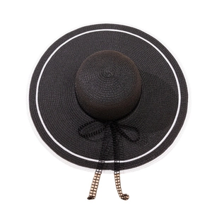 Chic black oversized straw sun hat with white trim and mesh bow for beach sun protection