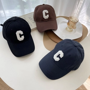 Three vintage cotton baseball caps with C letter embroidery in black, brown and navy