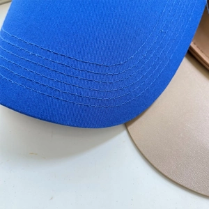 Detail shot of the royal blue cotton baseball cap brim with six-row precision stitching