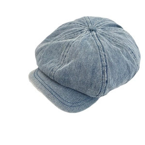 Classic blue wash denim newsboy cap with vintage eight-panel construction and small brim