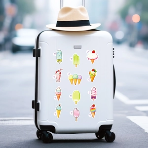 Detailed view of colorful summer ice cream stickers on a white suitcase handle area
